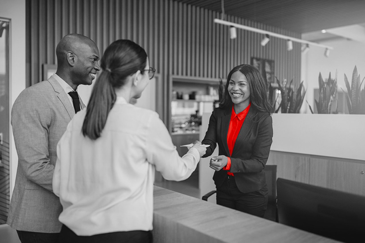 Lady shaking hands at a business meeting.
