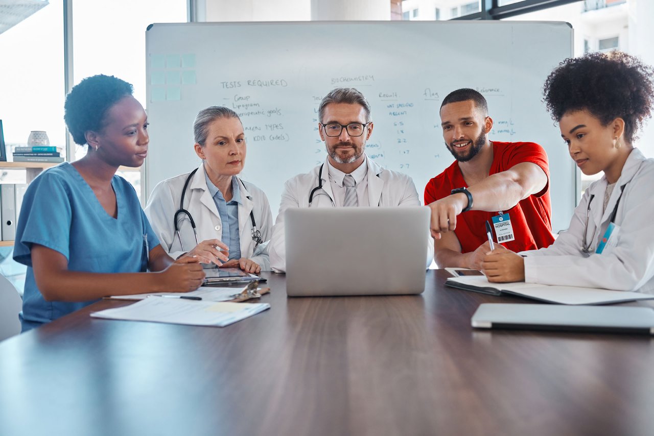 Doctors having group feedback session.
